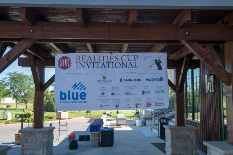 Sponsor banner at a charity golf tournament