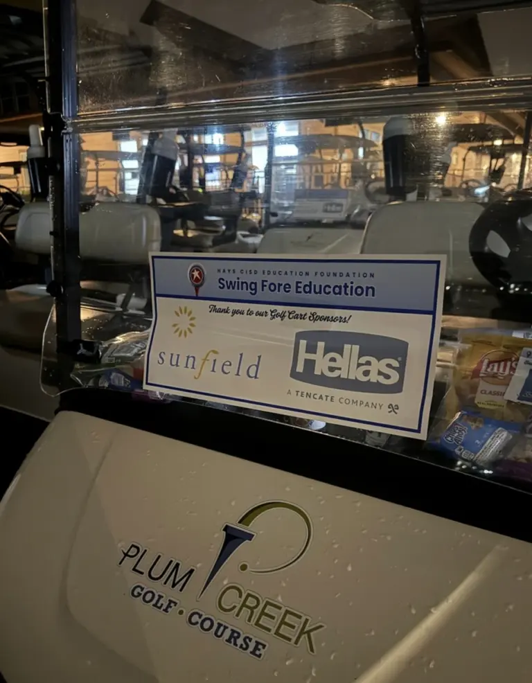Golf cart sponsor sign at a charity golf tournament