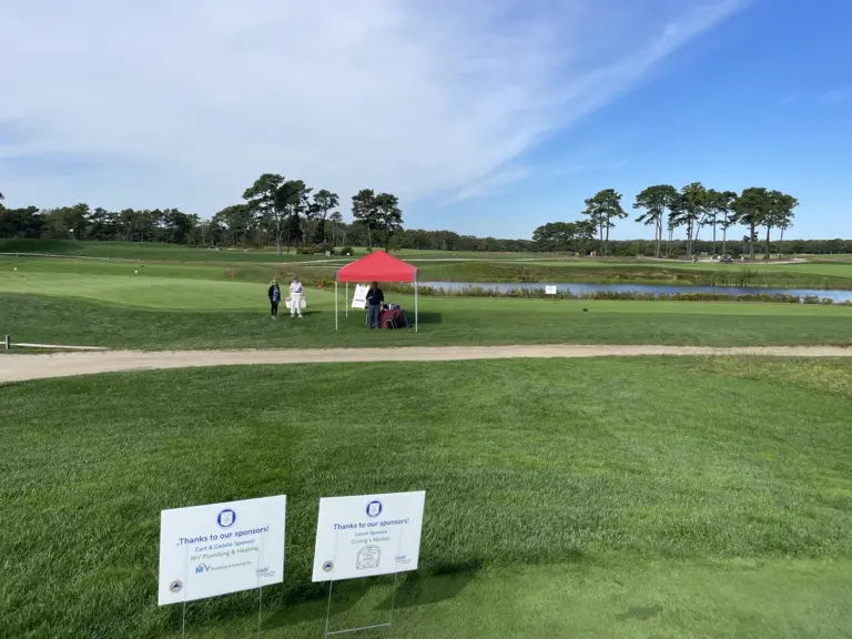 Tee sign at a charity golf tournament